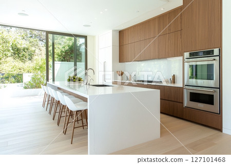 Explore bright and spacious kitchen with large island and expansive window for modern living 127101468