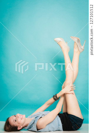 fashion girl relaxed with her legs raised up fashion girl relaxed with her legs raised up 127101512