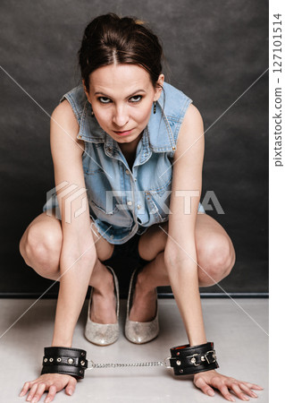 Arrest and jail. Criminal woman prisoner girl in handcuffs Arrest and jail. Criminal woman prisoner girl in handcuffs 127101514