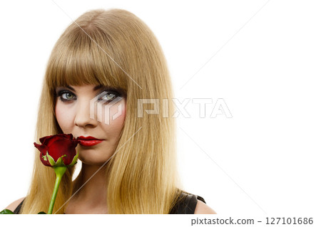 Woman gorgeous girl dark makeup holds rose flower 127101686