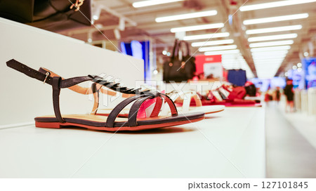 Shelf in shop with summer shoes sandal 127101845