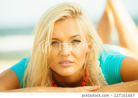 Beautiful blonde girl relaxing on beach 127101887