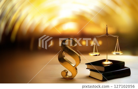 Golden Legal Symbols with Books and Gavel on Wooden Table 127102056