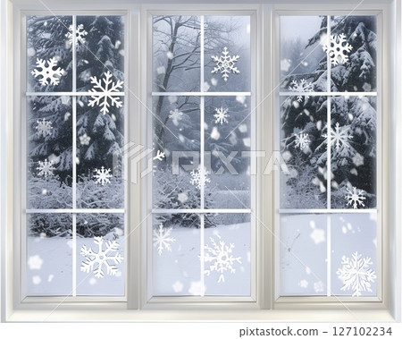 The frosted glass window, with a white wooden frame, reveals a tranquil winter wonderland outside, as snowflakes swirl in the distance. 127102234