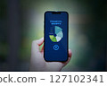 hand holding smartphone chart business app infos 127102341