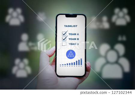 task list app in composite image of hand holding smartphone task list app in composite image of hand holding smartphone 127102344