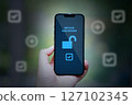 hand holding smartphone unlocked security icon 127102345