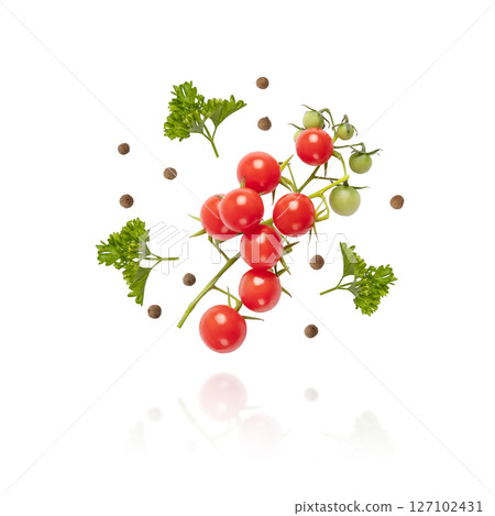 Flying tomatoes, parsley and black pepper isolated on a white background. Set for salad preparation, healthy snacks. Design element for product label Flying tomatoes, parsley and black pepper isolated on a white background. Set for salad preparation, healthy snacks. Design element for product label 127102431