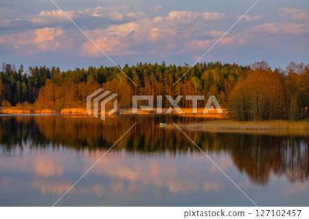 A Serene Lake Reflection with Vibrant and Colorful sunset colors 127102457