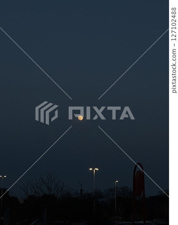 Full Moon Over a Quiet Night Street 127102488