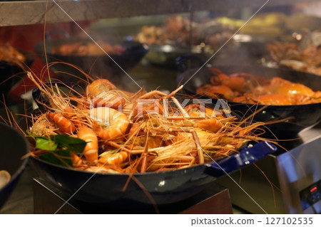 Nautical themed buffet table with seafood platters, decorations, and maritime details Nautical themed buffet table with seafood platters, decorations, and maritime details 127102535