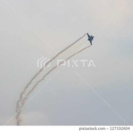 J-10 of China Air Force Aerobatics team on formations with colorful smokes venting from the plane. J-10 of China Air Force Aerobatics team on formations with colorful smokes venting from the plane. 127102604