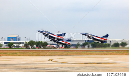 J-10 of China Air Force Aerobatics team on take off formations at airshow in Thailand. J-10 of China Air Force Aerobatics team on take off formations at airshow in Thailand. 127102636