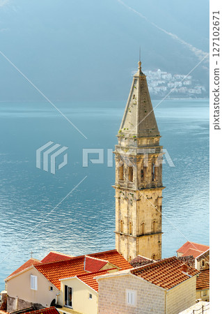 Scenic view of the church and the buildings of the old town of Perast. Sightseeing in Montenegro Scenic view of the church and the buildings of the old town of Perast. Sightseeing in Montenegro 127102671