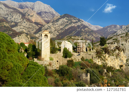 Picturesque view of Clock Tower in Old Town Bar (Stari Grad Bar) on the background of majestic Balkans mountains in Montenegro 127102781