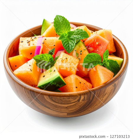 Refreshing Cantaloupe Cucumber Salad with Mint in Wooden Bowl 127103213