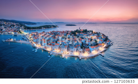 Aeriel view of old town with street lights on island at night 127103633