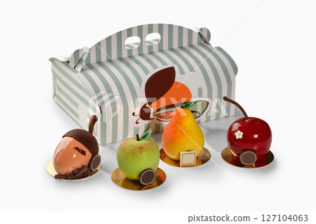 Fruit shaped desserts in front of pastry box from the braun family 127104063