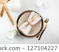 Elegant minimal table setting with wheat decoration in neutral tones 127104227