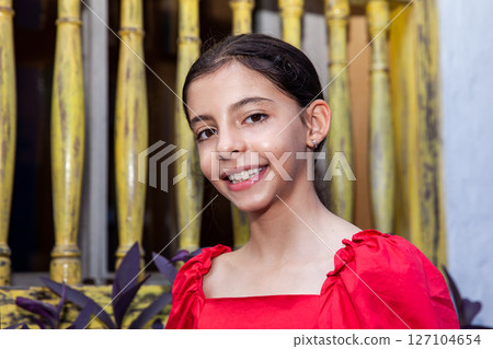 Sweet teenager girl in Cartagena de Indias. Travel concept. Sitting alone. Happy girl. Sweet teenager girl in Cartagena de Indias. Travel concept. Sitting alone. Happy girl. 127104654