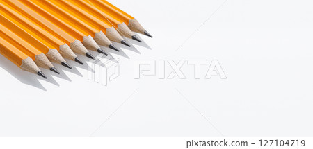 yellow graphite pencils with sharp tips lined up on a white background. Great for office use and art supplies yellow graphite pencils with sharp tips lined up on a white background. Great for office use and art supplies 127104719