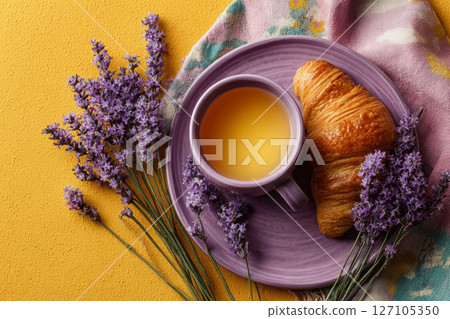Bright breakfast with croissant, tea and lavender bouquet 127105350