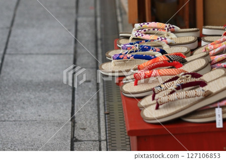 Japanese sandals lined up in front of a store Japanese sandals lined up in front of a store 127106853