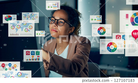 Conceptual visual of data analysis with foreign women working in the office Conceptual visual of data analysis with foreign women working in the office 127107183