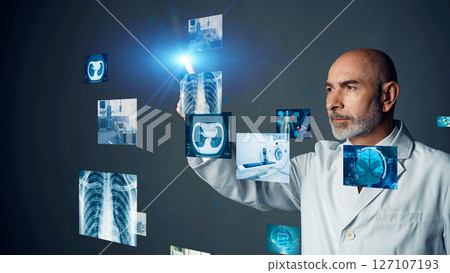 Conceptual visual of a foreign doctor looking at a medical screen Conceptual visual of a foreign doctor looking at a medical screen 127107193