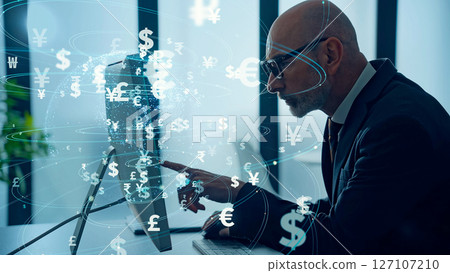 Conceptual visual of a businessman looking at a computer in an office and electronic money Conceptual visual of a businessman looking at a computer in an office and electronic money 127107210