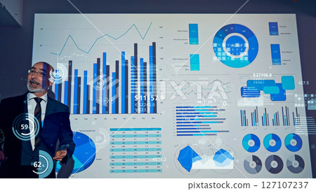 Conceptual visual of a foreign man giving a presentation and statistical data 127107237