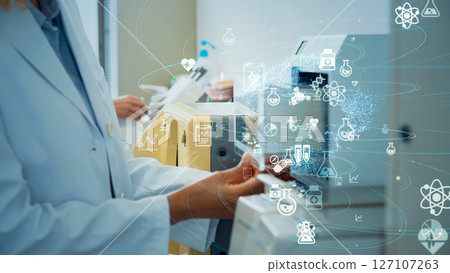 Research and development concept with multinational group of scientists conducting an experiment 127107263