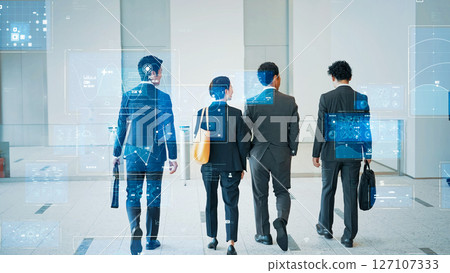 Digital data concept with group of business people walking in office 127107333