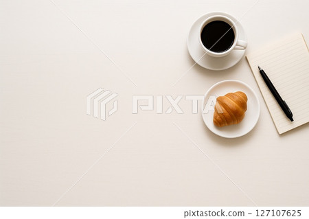 Simple life, white table and morning light 6, coffee, croissant and writing implements 127107625