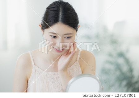 A young woman doing skin care A young woman doing skin care 127107801