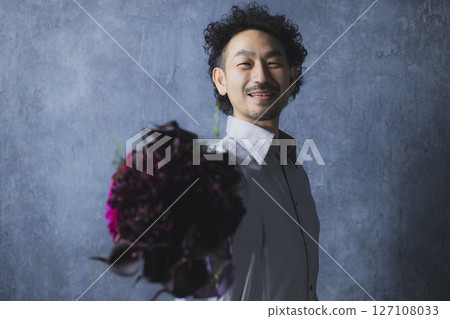 A man with a bouquet 127108033