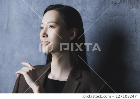 A woman in a black suit A woman in a black suit 127108247