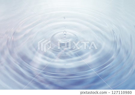 Drops of water falling on the surface of the water. 127110980