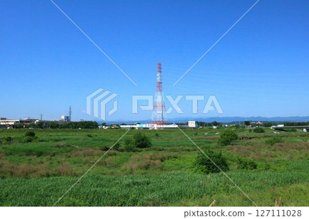 A red and white painted electricity transmission tower A red and white painted electricity transmission tower 127111028