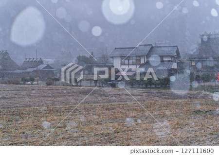 This photo was taken in Miyama-cho, Nantan-shi, Kyoto, in thatched roof village covered with snow. 127111600