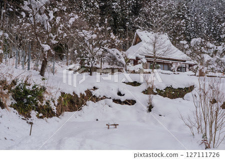 This photo was taken in Miyama-cho, Nantan-shi, Kyoto, in thatched roof village covered with snow. This photo was taken in Miyama-cho, Nantan-shi, Kyoto, in thatched roof village covered with snow. 127111726