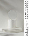 Pedestal for cosmetic product and packaging mockups display presentation. Three geometries podiums decorated on white background with shadow leaf 127111990