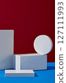 Empty white podiums to display products, goods decorated on red and blue background. Front view, minimal scene for products showcase, promotion display 127111993