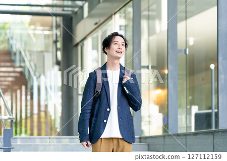 Businessmen working in an office. Filming cooperation: SKY Perfect Tokyo Media Center 127112159