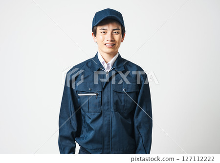 A young man in his 20s wearing work clothes A young man in his 20s wearing work clothes 127112222