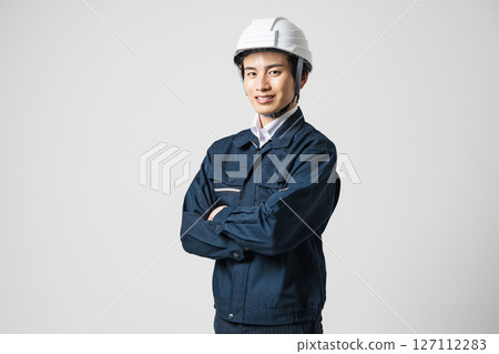 Portrait of a man in his 20s working in the construction industry 127112283