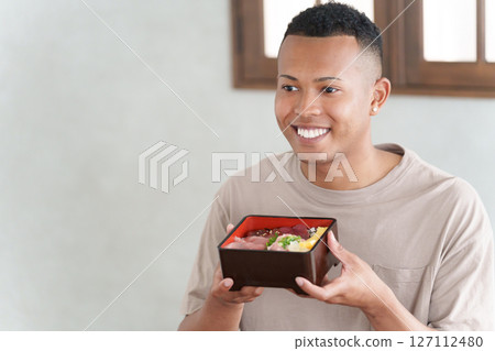 Foreign tourists eating Japanese food Foreign tourists eating Japanese food 127112480