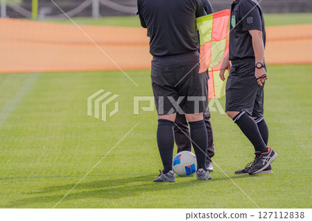 Soccer ball and referee 127112838