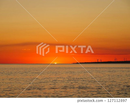 Sunset over the sea 127112897