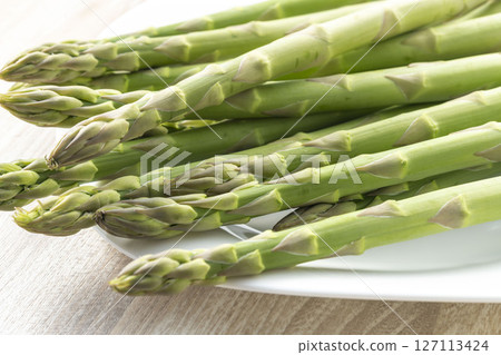 Fresh and delicious green asparagus 127113424